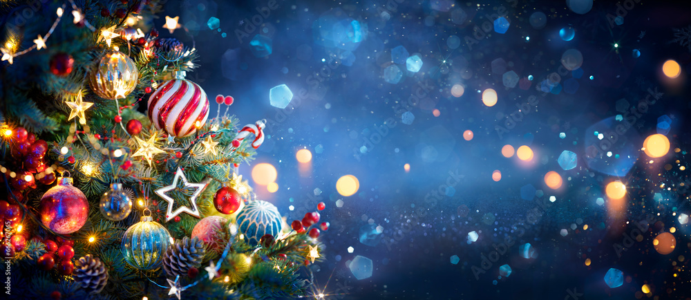 Wall mural christmas tree with ornaments in blue and bokeh lights - real fir branches with glittering in abstra