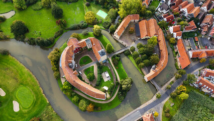 Aerial drone view water castle Wasserschloss Burgsteinfurt Steinfurt, North Rhine-Westphalia, Germany.
