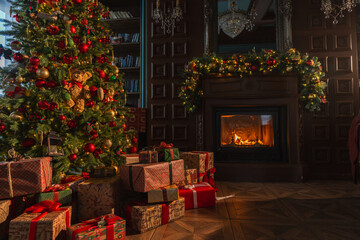 Classical Christmas decorated interior living room library with fireplace. Christmas tree with red golden ornament decorations. Modern classic style interior design apartment. Christmas eve at home