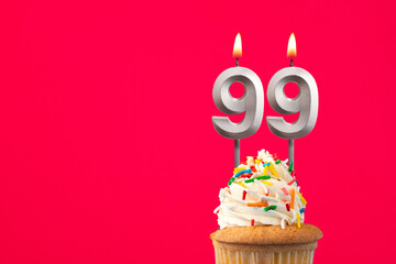 Burning candle number 99 - Birthday card with cake