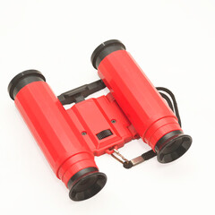Toy binoculars on a white background