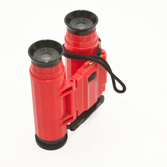 Toy binoculars on a white background