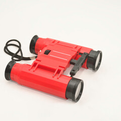 Toy binoculars on a white background