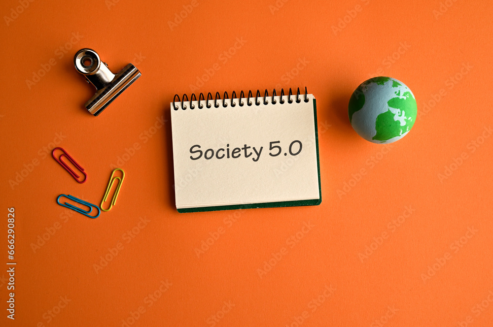 Aufkleber there is notebook with the word society 5.0. it is as an eye-catching image.