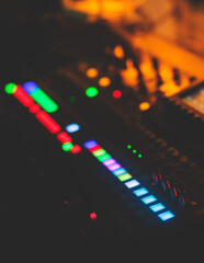 View of lighting technician operator working on mixing console workplace during live conference...