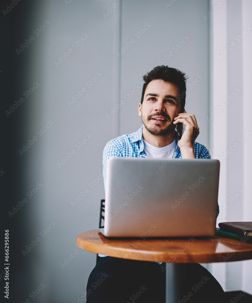 Poster positive man using mobile application for talking
