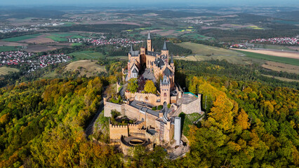 Aerial drone view of medieval Hohenzollern castle on top of hill in autumn, Baden-Wurttemberg, Germany - obrazy, fototapety, plakaty