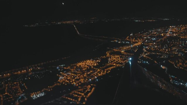 View of night lights of city from above from plane