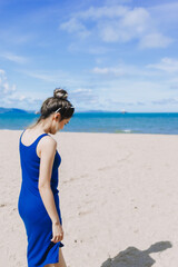 Portrait of asian woman feeling hot and burn from the sun on sunny beach.