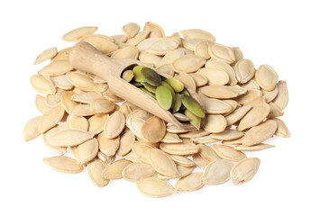 Wooden scoop and pumpkin seeds isolated on white
