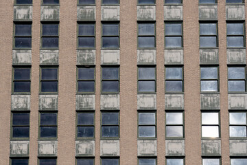 High antique wall with multiple windows with dark reflections abstract backgrounds.