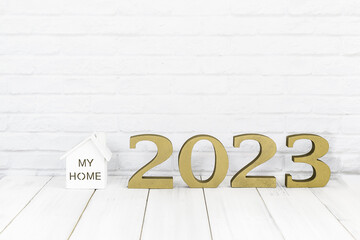 2023 new year and home  on white wood table over white background with copy space , Real estate concept