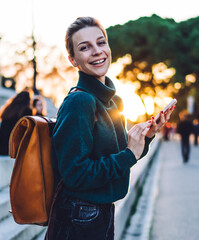  happy tourist with travel backpack rejoicing