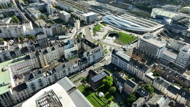 Drone dolly shot over the modern new Rennes station on a sunny day.