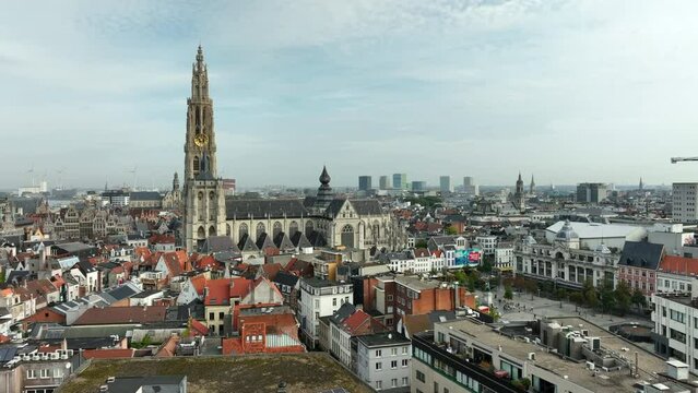 Cathedral of Our Lady in Antwerp on a partly sunny day. Drone dolly shot