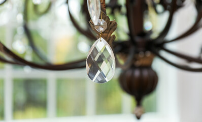 chandelier with intricate crystal details, casting elegant light patterns in a luxurious setting,...