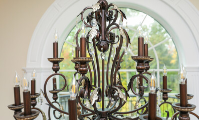 chandelier with intricate crystal details, casting elegant light patterns in a luxurious setting,...