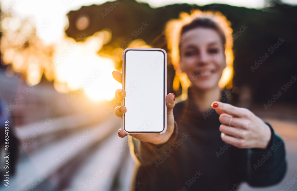 Poster selective focus on smartphone display with copy space area for text delivery advertising