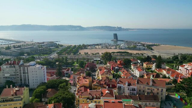 Descending over houses with Alges cityscape and riverside  tejo river as  background .Oeiras,Portugal