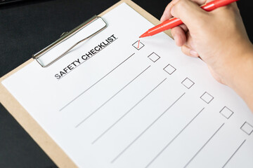 Blank checklist paper during safety audit and risk verification. safety checklist form on the desk...
