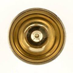 a shiny round brass oil lamp with wick holder isolated in a white background viewed from the top