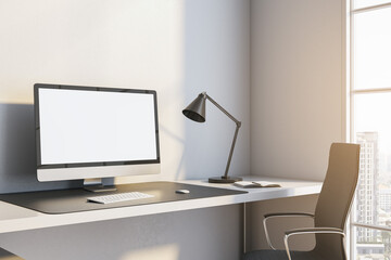 Close up of modern workplace with mock up place on white computer monitor, lamp and window with city view and daylight. 3D Rendering.