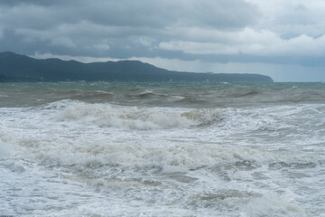 storm on the black sea, waves crashing on the shore, brown water