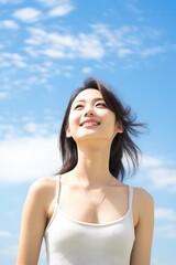 Fototapeta na wymiar Portrait of a beautiful woman and a bright smile Asian people with background Bright blue sky as the background