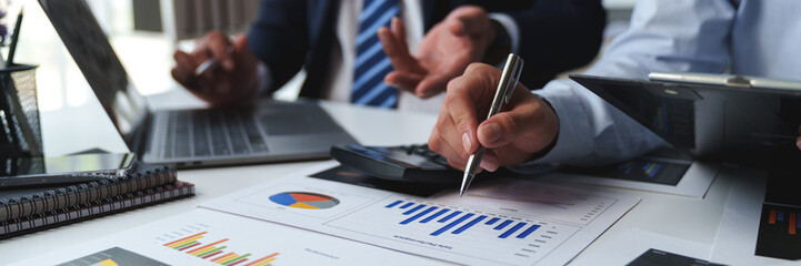 Asian male financial officer or accountant checking investment results Financial budget analysis Planning to summarize results and report to the meeting Audit concept and investment results.