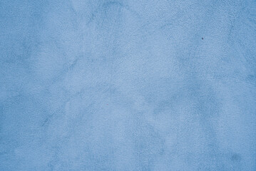 Abtract light cyan stucco wall background, blue painted cement wall texture.