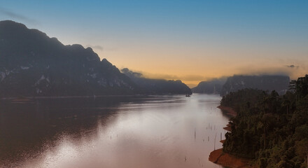 The Aerial  sunset view at Khao Sok national park Cheow Lan Dam lake with blue sky background  in Surat Thani, Thailand