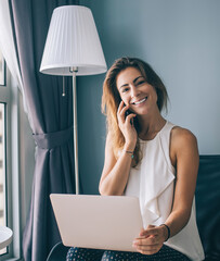 positive woman calling via cellphone