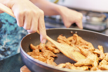 Cooking fresh pork with marinade. Pork pieces in frying pan