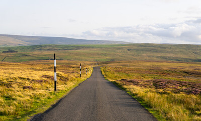 a quiet road running through the North Pennines Area of Outstanding Natural Beauty (ANOB), near Stanhope, Durham, UK