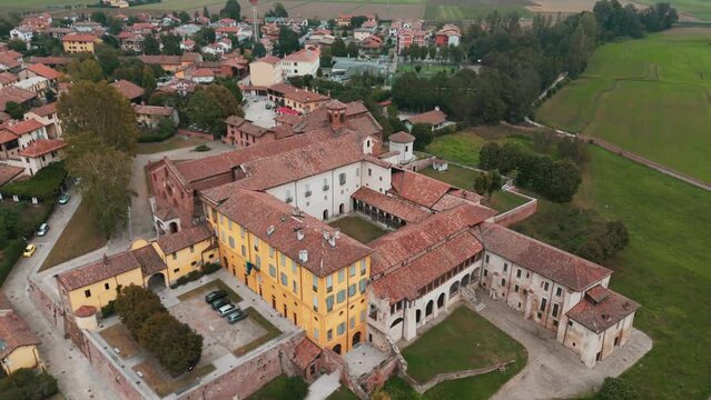 Orbiting Abbazia Morimondo top shot in the countryside of Lombardia close to Abbiategrasso