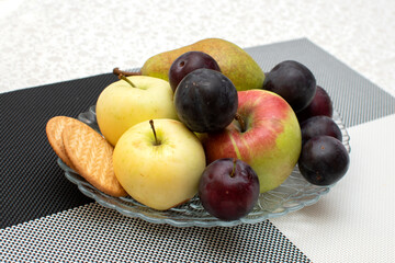 Still life with cookies, plums, apples and pears	