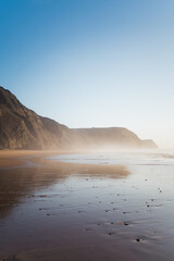 Full shot of a beach with rocky mountains in the Algarve, Portugal. Cordoama beach.