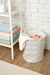 Fabric laundry basket in a bathroom close up