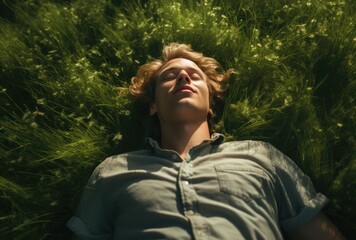 Young man lying down in the park