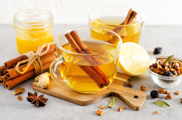 Autumn or Winter Hot Tea, Herbal Tea with Spices on Bright Background