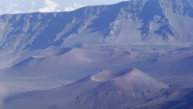 Cinematic panning shot of the cinder cones craters at the summit of Haleakala on the Hawaiian island of Maui. 4K HDR at 30 FPS