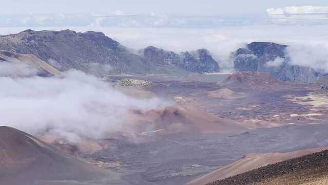 Cinematic panning shot of the volcanic crater from the Sliding Sands trail at the summit of Haleakala in Maui, Hawai'i. 4K HDR at 30 FPS