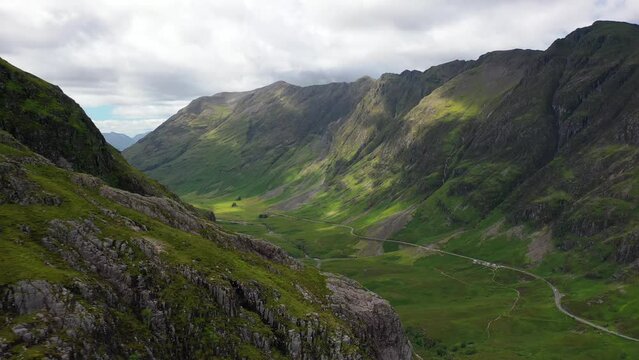 Glencoe, Scottish highlands. The Three Sisters Mountains. Aerial sweep around mountain. Scotland, United Kingdom