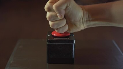Pressing big red button with male hand. concept of the red button