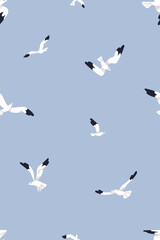 Obraz premium Seagulls, seamless pattern. Flying birds, endless background design, repeating print. Sea gulls fly, soar in blue sky. Printable flat vector illustration for textile, fabric, wallpaper, wrapping