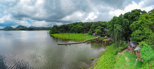 stunning aerial photo of a rustic dock pier in the middle of the jungle of america mexico 4k...