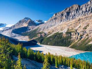 Lake Peyto, Banff National Park, Alberta, Canada. Landscape during daylight hours. A lake in a mountain valley. Mountains and forest. Natural landscape. Photo for postcards, background and wallpaper. - Powered by Adobe