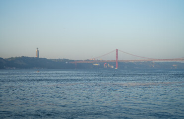 the statue of Jesus Christ and the bridge in Lisbon on a sunny day. Landscape.