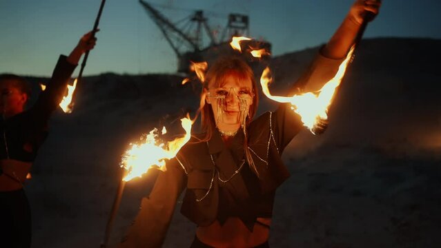 Attractive Women Dancing With Burning Torches And Looking To Camera, Amazing Fire Performance