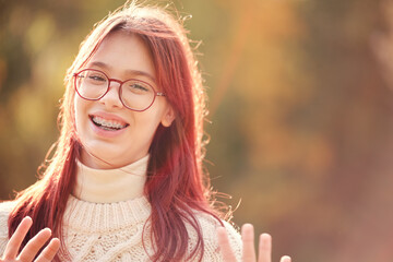 Beautiful joyful girl with long hair, sunlight, autumn colors.